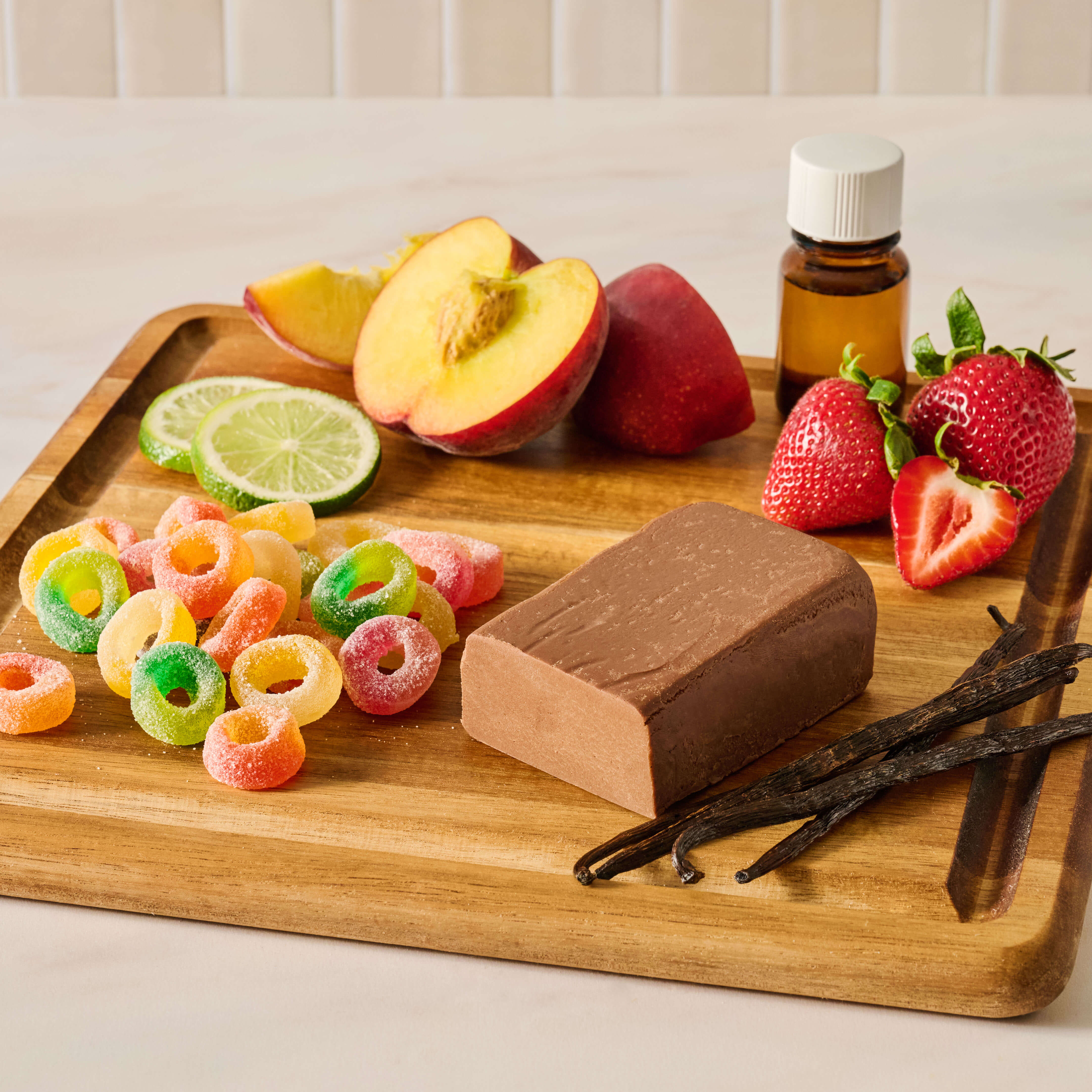 Image of gummy fruit candy and chocolates surrounded by fruit and ingredients.
